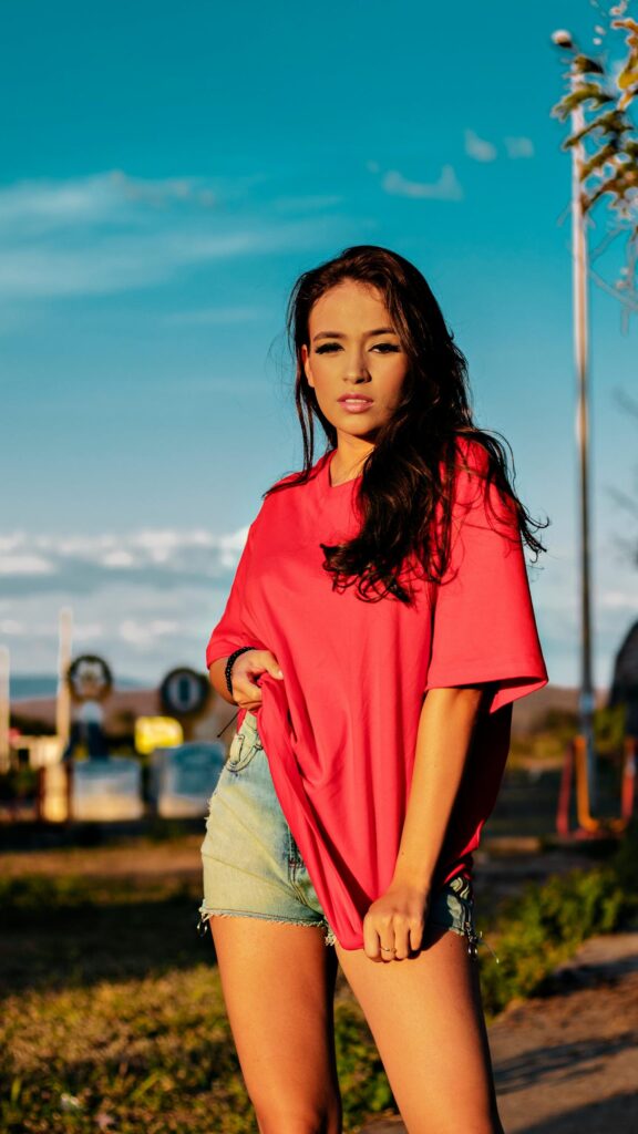 Stunning Young Woman in Pink Shirt Casual Summer Style Mobile Wallpaper