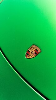 Vivid Green Porsche Logo Close-up Luxury Car Mobile Wallpaper