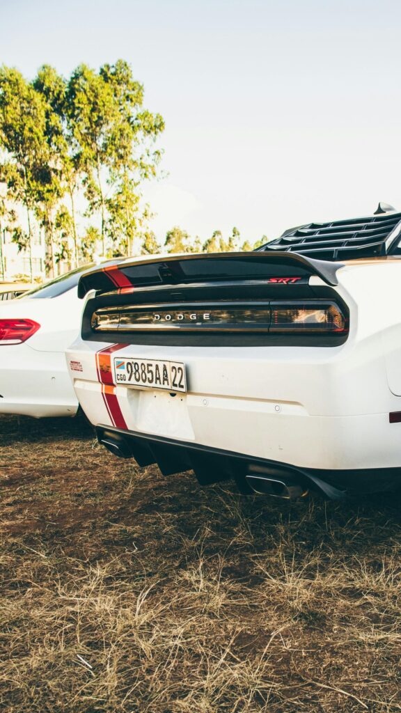 White Dodge Challenger SRT Rear View with Racing Stripes Mobile Wallpaper