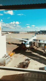Lufthansa Airplane Parked at Airport Gate Sunny Day Wallpaper