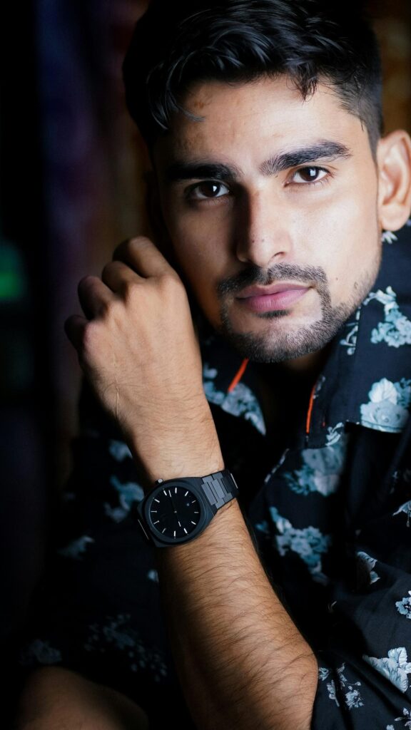 Portrait of a Handsome Man with Floral Shirt and Watch Wallpaper