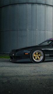 Aggressive Black JDM Nissan 240SX with Gold Wheels Mobile Wallpaper