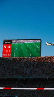 Stunning River Plate Stadium View with Airplane Mobile Wallpaper