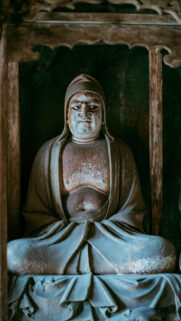 Zen Meditation Monk Statue Serenity Spiritual Aesthetic Wallpaper