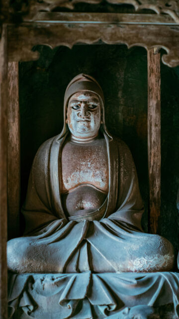 Zen Meditation Monk Statue Serenity Spiritual Aesthetic Wallpaper