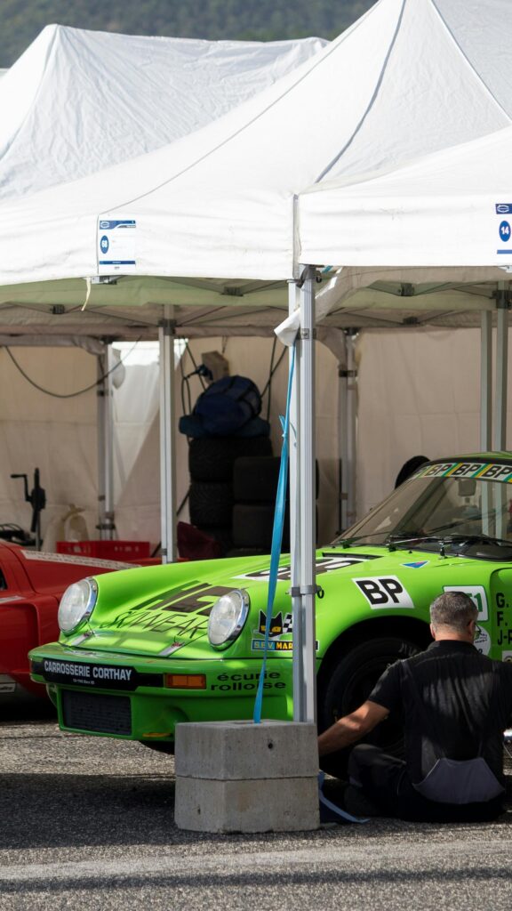 Vibrant Neon Green Porsche Classic Race Car Pit Stop Mobile Wallpaper