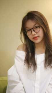 Beautiful Young Asian Woman in White Off-Shoulder Top Portrait Wallpaper