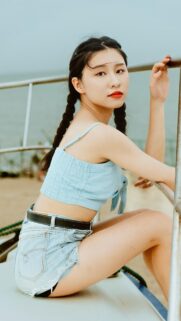 Beautiful Young Asian Woman in Blue Summer Outfit Phone Wallpaper