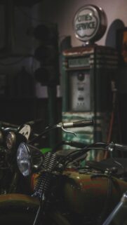 Vintage Harley Davidson Motorcycle and Retro Gas Pump Wallpaper
