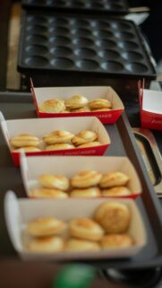 Freshly Baked Mini Pancakes in Red Serving Boxes Wallpaper