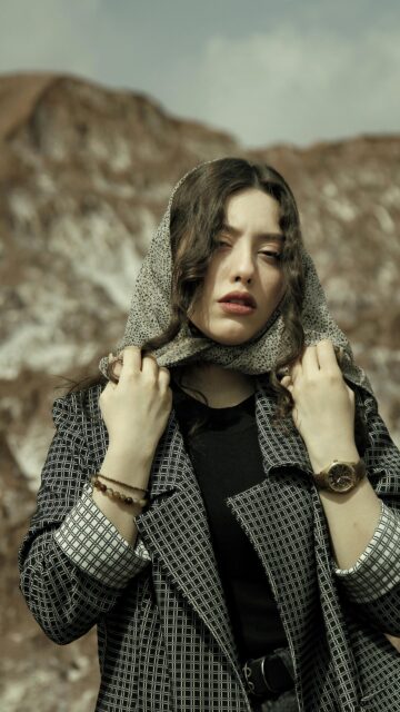 Elegant Woman in Patterned Scarf and Blazer Portrait Wallpaper