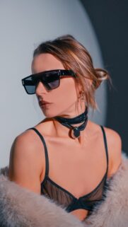 Stylish Woman in Faux Fur and Designer Sunglasses Fashion Wallpaper