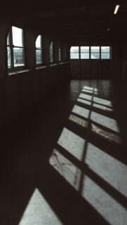 Minimalist Sunlight and Shadows Through Industrial Windows Wallpaper