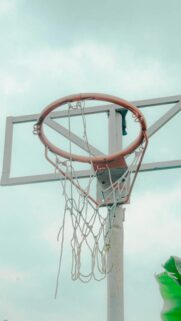 Minimalist Basketball Hoop Against a Serene Sky Vertical Phone Wallpaper