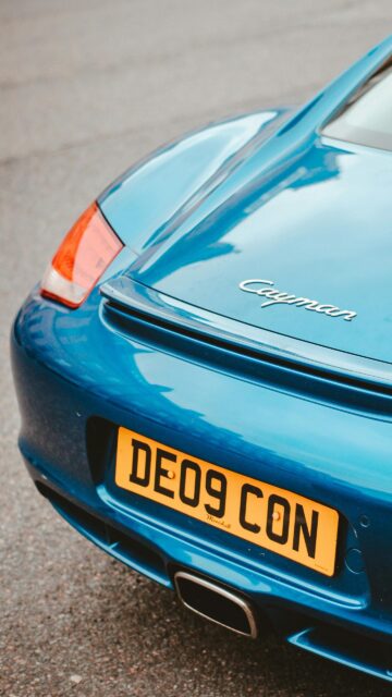 Blue Porsche Cayman Rear View Sportscar Phone Wallpaper