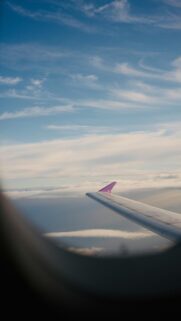 Airplane Wing Over Cloudscape Above the Skies Aesthetic Mobile Wallpaper