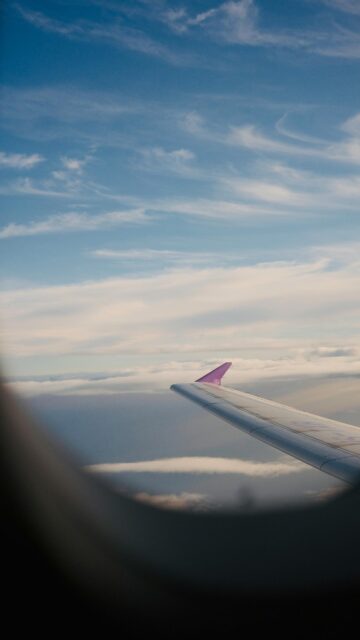 Airplane Wing Over Cloudscape Above the Skies Aesthetic Mobile Wallpaper