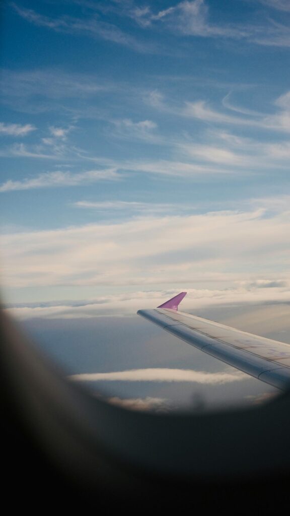 Airplane Wing Over Cloudscape Above the Skies Aesthetic Mobile Wallpaper