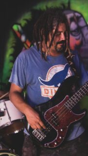 Musician Playing Bass Guitar with Dreadlocks Street Art Style Mobile Wallpaper