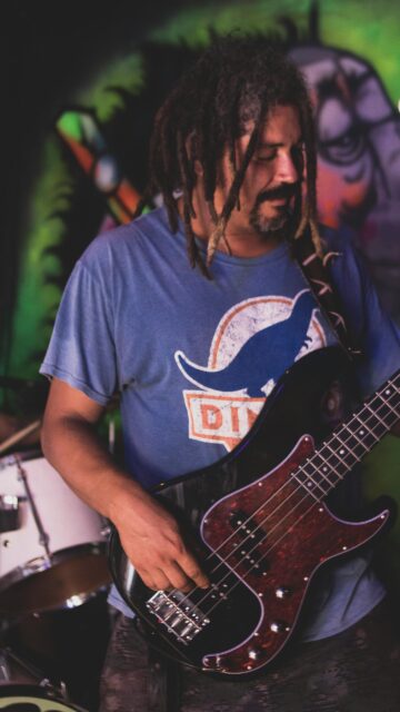 Musician Playing Bass Guitar with Dreadlocks Street Art Style Mobile Wallpaper