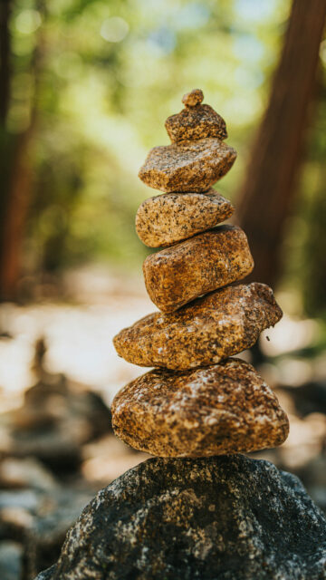Zen Stone Stacking for Chakra Balancing and Spiritual Grounding Wallpaper
