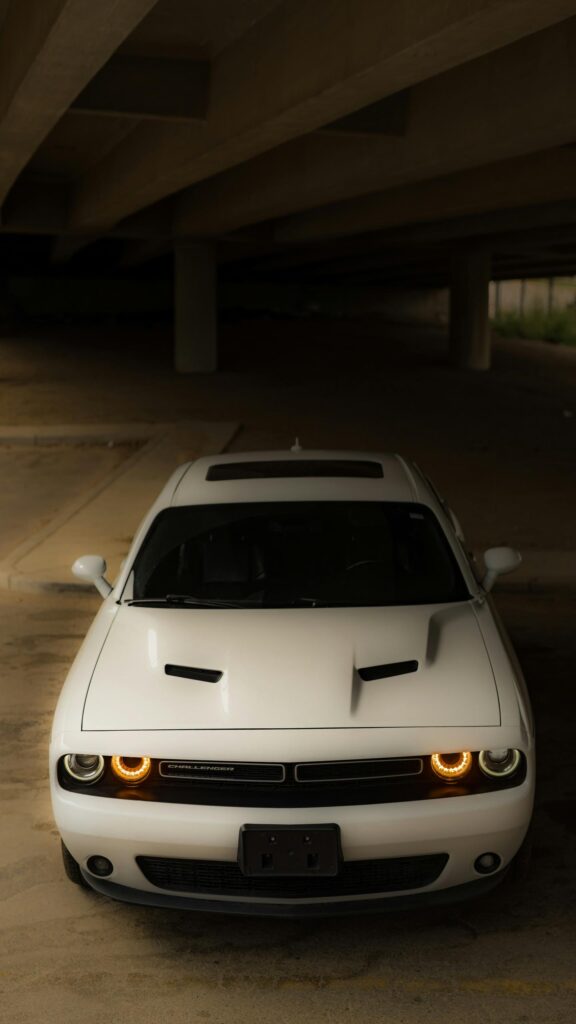 Aggressive White Dodge Challenger Front View Mobile Wallpaper