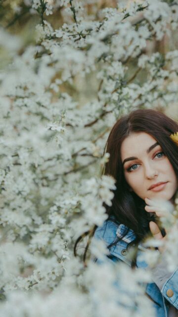 Beautiful Girl Surrounded by Blooming Spring Cherry Blossom Wallpaper