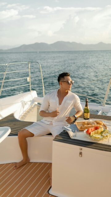 Man Enjoying Luxury Yacht Sunset Champagne Lifestyle Mobile Wallpaper