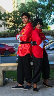 Cosplay Duo in Vibrant Red Martial Arts Outfits Wallpaper