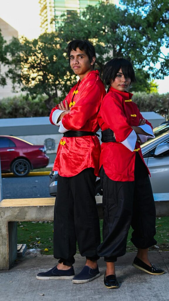 Cosplay Duo in Vibrant Red Martial Arts Outfits Wallpaper