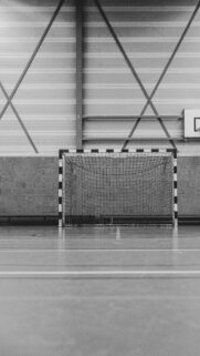 Minimalist Indoor Handball Goal Court Black and White Wallpaper