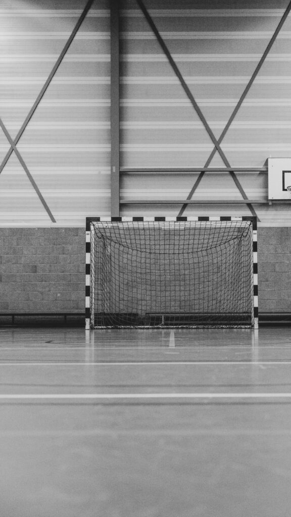 Minimalist Indoor Handball Goal Court Black and White Wallpaper