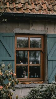 Rustic Cottage Window with Teal Shutters Mobile Wallpaper