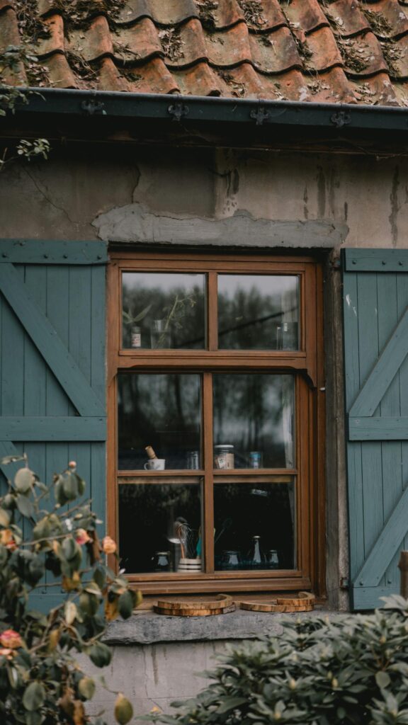 Rustic Cottage Window with Teal Shutters Mobile Wallpaper