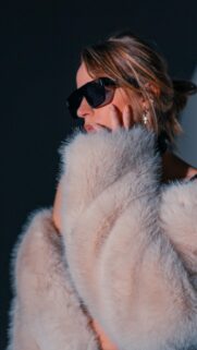 Chic Woman in Luxury Faux Fur Coat and Sunglasses Mobile Wallpaper