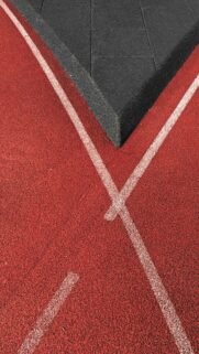 Abstract Red Track and Black Rubber Surface Minimalist Phone Wallpaper