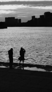 Silhouette Couple at River Sunset Black and White Phone Wallpaper