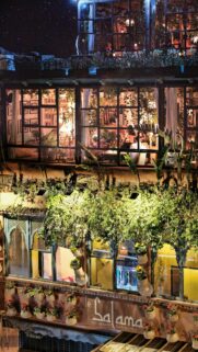 Enchanting Moroccan Restaurant Exterior at Night Phone Wallpaper