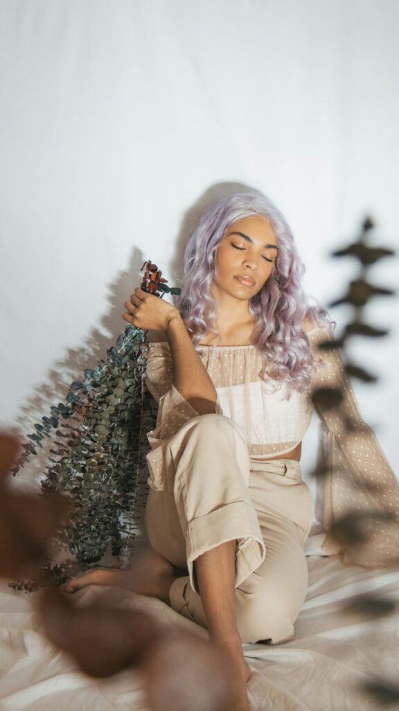 Dreamy Woman with Lavender Hair and Eucalyptus Branches Wallpaper