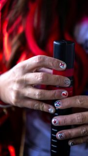 Close-up Circus Inspired Nail Art and Baton Mobile Wallpaper