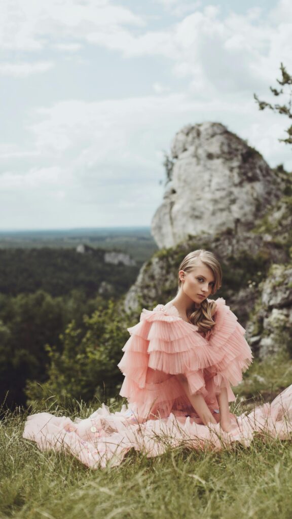 Ethereal Woman in Pink Ruffled Gown Outdoor Fantasy Portrait Wallpaper