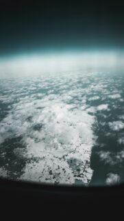 Stunning Aerial Winter Landscape with Snowy Fields and Ocean Wallpaper