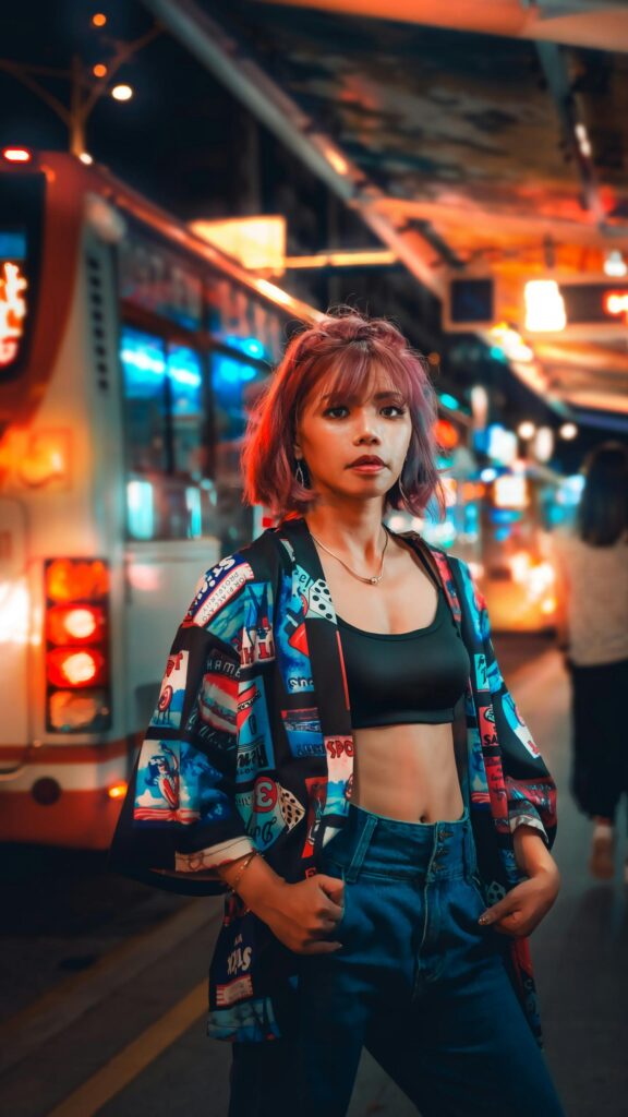 Urban Street Style Woman with Pink Hair Night City Life Wallpaper