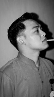Black and White Portrait of Young Man Smoking Mobile Phone Wallpaper