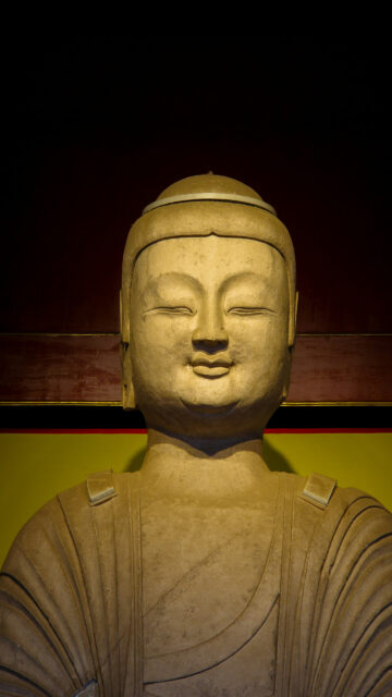 Serene Buddha Statue Zen Meditation and Spiritual Energy Wallpaper