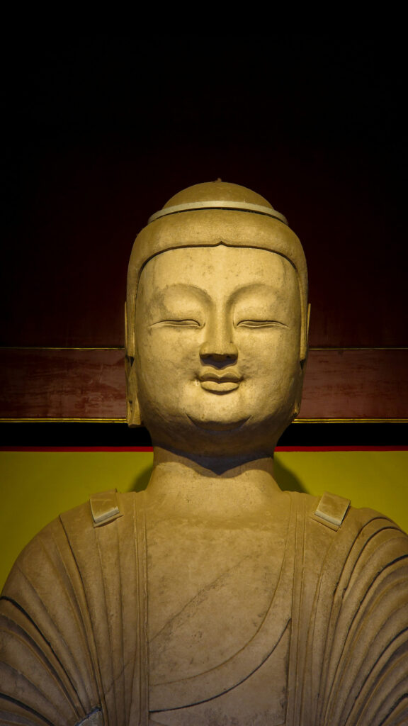 Serene Buddha Statue Zen Meditation and Spiritual Energy Wallpaper