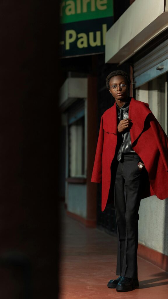 Stylish Young Man in Vibrant Red Coat Fashion Portrait Wallpaper
