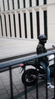 Biker in Plaid Jacket on Sport Bike Urban Street Style Wallpaper