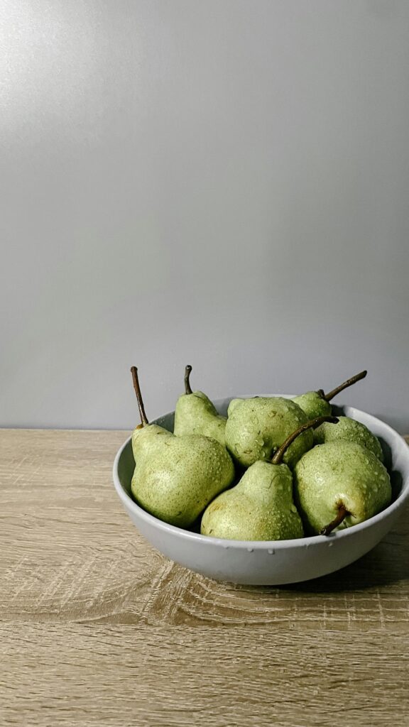Fresh Green Pears in a Minimalist Bowl Mobile Phone Wallpaper