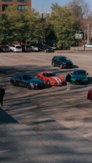 Supercars Meetup in Sunny Parking Lot High-Quality Phone Wallpaper